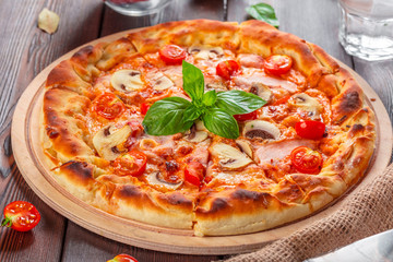 Delicious fresh pizza served on wooden table