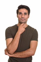 Young handsome Persian man against white background