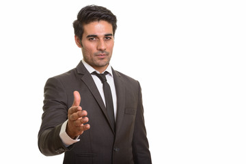 Young handsome Persian man against white background