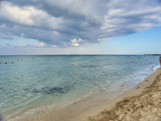 Fototapeta na wymiar Shot of the beautiful tropical San Lorenzo beach near Syracuse in a sunny day of summer