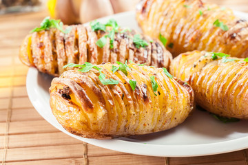 Baked potatoes with cheese and herbs