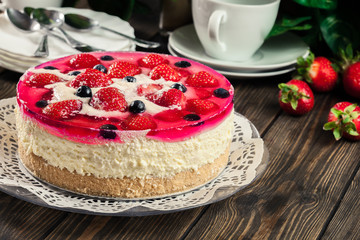 Cheesecake with strawberries, blueberry and jelly