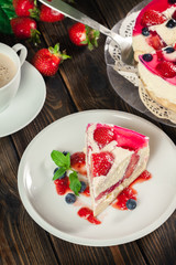 Cheesecake with strawberries, blueberry and jelly