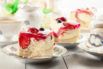 Cheesecake with strawberries, blueberry and jelly