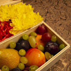 festive composition in a wooden box with fruit