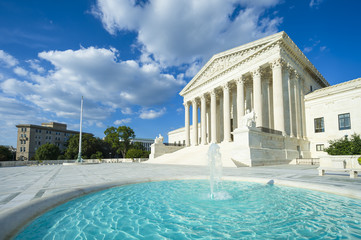 United States Supreme Court building exterior with bright fountain in the foreground