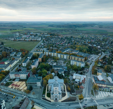 The cityscape of Joniskis, Lithuania during early autumn morning. Church in foreground.