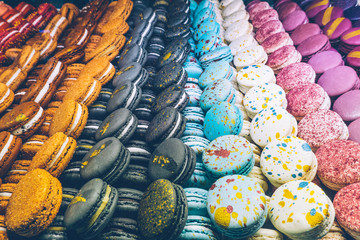 A lot of colorful macaroons on the candy shop.