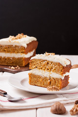 Homemade carrot orange cake with cream cheese, traditional american afternoon tea treat.