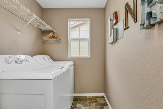 Laundry room interior with washer and dryer
