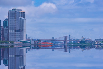 Fototapeta na wymiar Brooklyn Bridge in New York City at clounds sky, Skyline of downtown New York, USA