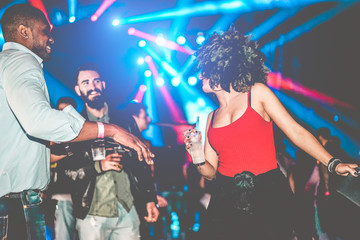 Happy friends having party in night club