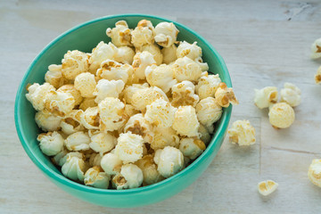 Green bowl with popcorn