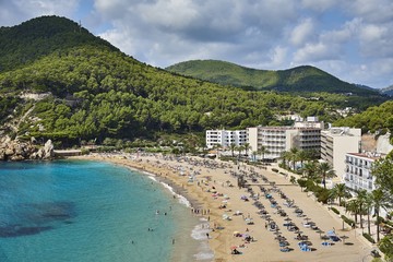 Paradise beach in Ibiza island with blue sky and crystal water
