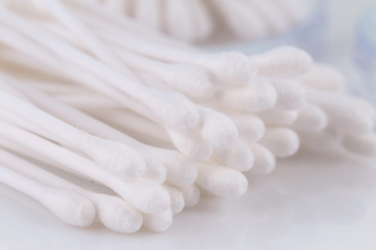 Cotton buds on a light background. Selective focus