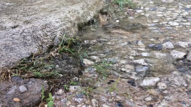 Water flow in Small weir or check dam in countryside.