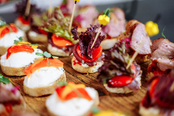Luxury banquet table setting in restaurant. Table with the snacks.