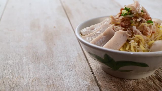 Chicken shredded noodle soup with fishballs
