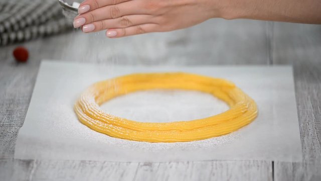 The Process of Making Paris Brest. Sprinkle with powdered sugar raw dough