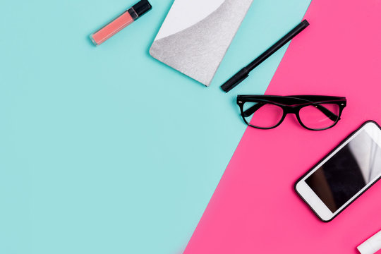 Flat lay traveler and office accessories on a colored background