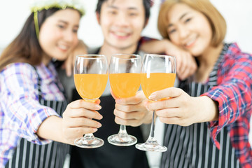 Three friends Enjoying Party glass , drinking orange juice cocktail together
