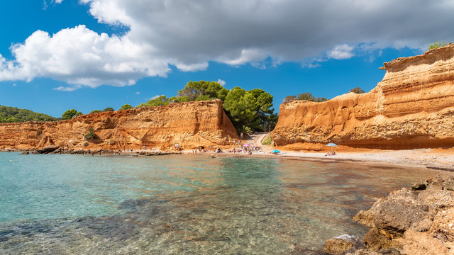 Ibiza, Sa Caleta beach, beautiful red earth with cliffs

