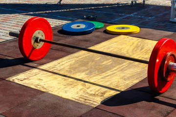 Barbell on the floor in gym