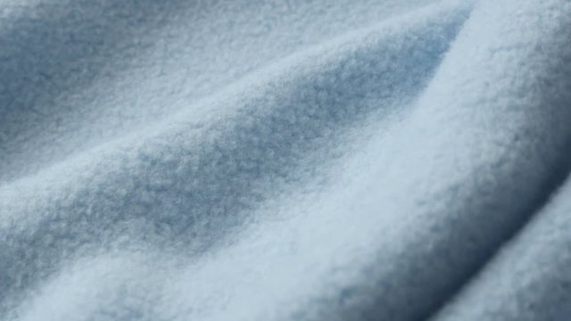 Blue polar fleece blanket close-up 4K panning video