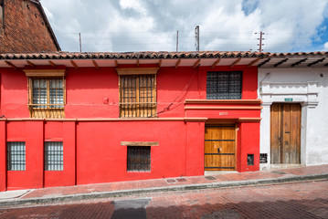 Home facades in La Candelaria neighborhood of Bogota, Colombia, known for its colorful Spanish colonial architecture.