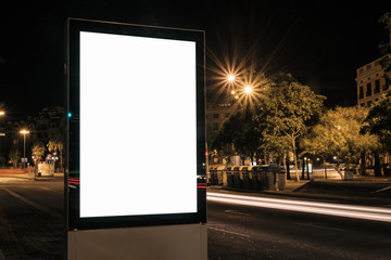Light box display with white blank space for advertisement. Horizontal mock-up design concept with car light trails at night.