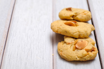 Hazelnuts cookies on white wooden table