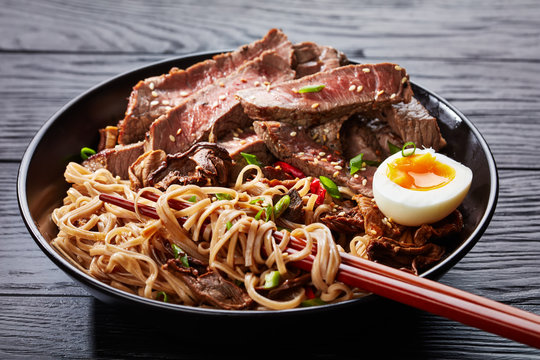 close-up of a bowl of Soba noodles and beef