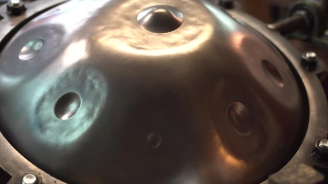 Handpan on a construction tool in a musician workshop.