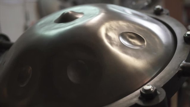 Handpan on a construction tool in a musician workshop.
