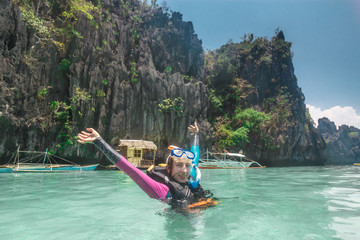 Female snorkeling underwater - Adventure travel lifestyle enjoying happy fun moment - Trip around Philippines wonders