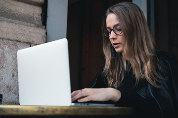 young woman working on laptop