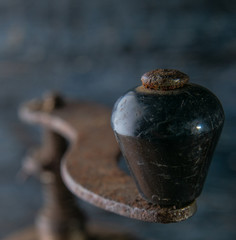 macro photo of rust and various parts of the old coffee grinder