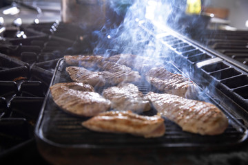 Chef at work in a restaurant kitchen making delicious food
