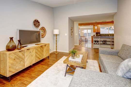 Living Room In Neutral Colors With Hardwood Floor.