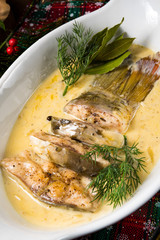 fried christmas carp in butter sauce with dill and lemon