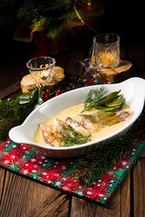 fried christmas carp in butter sauce with dill and lemon