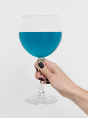 A glass of blue wine