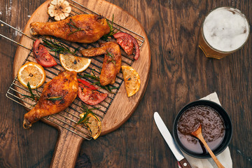 Hot and spicy chicken drumstick and wings closeup with beer