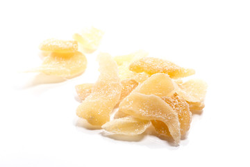 Close-up of dried ginger candy on white background