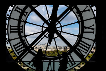 Musee d'Orsay visitors looking at Montmartre view through the giant glass clock - Paris, France