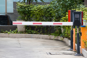 security barrier system at the gate of car park background, red and white steel Rising Arm Access...