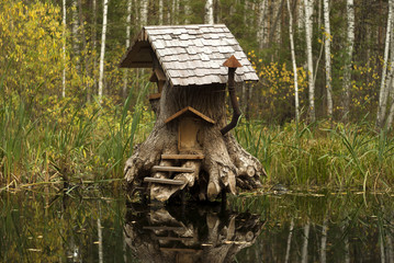 Rerm, Russia - Octoder 02, 2018: art object - house of fairy creatures in stump on the swamp