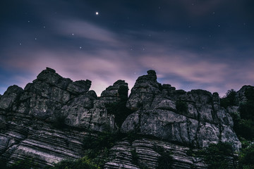 Torcal rocky mountains with the cloudy purple sky in the background