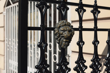  wrought iron with brass lion's head