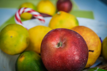 Juicy and fresh fruit in a plate on the table